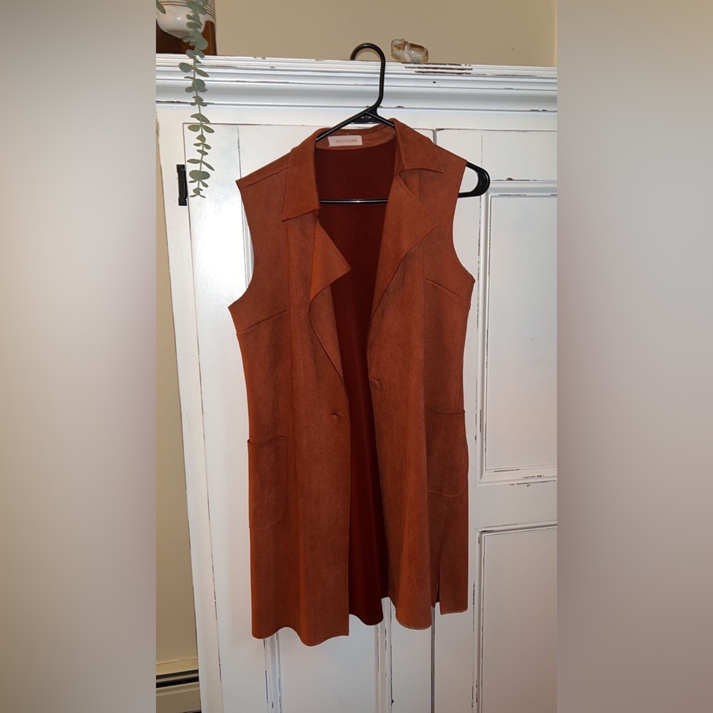 Rust orange sleeveless blazer